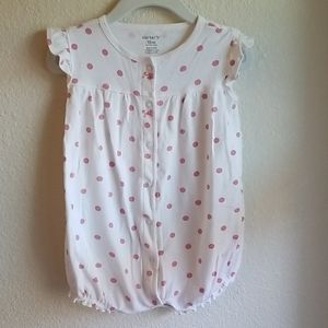 Short sleeved, short jump suit.